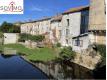 CENTRE VILLE, IMMEUBLE A USAGE D'HABITATION ET COMMERCIAL AV Charente Confolens